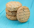 Biscuit with seasame on a blue wood Royalty Free Stock Photo