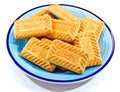 Shortbread biscuits on a blue plate.