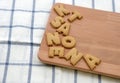 Biscuits ABC on wooden plate Royalty Free Stock Photo