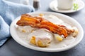 Biscuits and gravy with bacon for breakfast