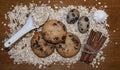 Biscuits, oats flakes, cinnamon sticks, meringue, eggs on a wood