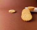 biscuits on white dish and isolated, round biscuits on brown background Royalty Free Stock Photo