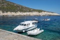 Bisevo, Croatia - Aug 16, 2020: Tour guide speed boat at blue cave port in summer
