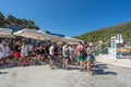Bisevo, Croatia - Aug 16, 2020: Tourist queue to board on boat to blue cave tour in Komiza