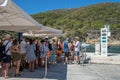 Bisevo, Croatia - Aug 16, 2020: Tourist queue to board on boat to blue cave tour in Komiza