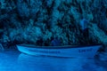 Bisevo, Croatia - Aug 16, 2020: Tourists on a boat in serene blue cave near Komiza island