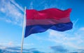 Bisexual Pride flag waving in the wind at cloudy sky. Freedom and love concept. Pride month. activism, community and freedom Royalty Free Stock Photo