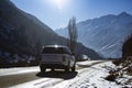 Bishkek, Kyrgyzstan - DEC 10, 2022: asphalt Road in Kyrgyzstan mountains with range rover car Royalty Free Stock Photo