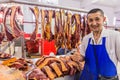 BISHKEK, KYRGYZSTAN - JULY 11, 2018: Horse meat seller at the Osh bazaar in Bishkek, capital of Kyrgyzsta