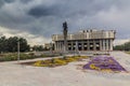 BISHKEK, KYRGYZSTAN - JULY 11, 2018: Philarmonic Hall Named Toktogul Satylganov and Manas Statue in Bishkek, capital of Royalty Free Stock Photo