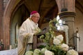 Bishop at the altar inside of a catholic church Royalty Free Stock Photo