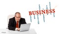 bisinessman sitting at desk and looking laptop with business word cloud Royalty Free Stock Photo