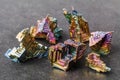 Bismuth rainbow metal on the dark stone background Royalty Free Stock Photo