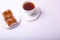 Bisquit cakes and tea cup on white background Royalty Free Stock Photo