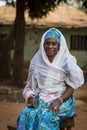 Portrait of a woman wearing a traditional dress with veil, at the Missira neighborhood in the city of Bissau Royalty Free Stock Photo