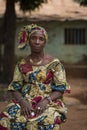 Portrait of a woman wearing a traditional dress with veil, at the Missira neighborhood in the city of Bissau, Guinea Bissau Royalty Free Stock Photo
