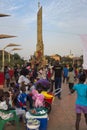 Street scene in the city of Bissau with people at the Praca dos Herois Nacionais, in Guinea-Bissau