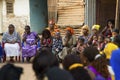 Portrait of a group of women and children at a community reunion in the Bissaque neighbourhood in the city of Bissau