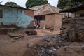 Children playing in front of their home, in a slum with an open air sewer, at in the city of Bissau