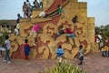 Children playing at a statue in the Praca dos Herois Nacionais, in Guinea-Bissau