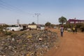 People selling cows near a landfill in the outskirts of the city of Bissau, in Guinea-Bissau, West Africa.