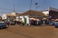 Street scene in the city of Bissau with people vendors selling vegetables and fish, in Guinea-Bissau.