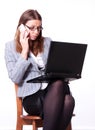 Bissines woman with laptop and smartphone glancing Royalty Free Stock Photo