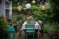 bistro table with mismatched chairs and lantern for al fresco dining Royalty Free Stock Photo