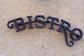 Bistro text sign word french means bar cafe on building city street restaurant Royalty Free Stock Photo