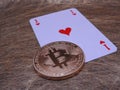 Bitcoin and ace of hearts. Royalty Free Stock Photo