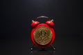 Bitcoin and alarm clock on black background. Deadline concept for investing in bitcoin cryptocurrency. Royalty Free Stock Photo