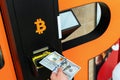 Bitcoin atm machine money. Usd hundred money payment on virtual crypto currency btc wallet. Woman withdraw american