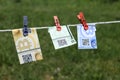 Bitcoin banknotes with clothespins