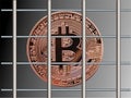 Bitcoin behind bars. Royalty Free Stock Photo