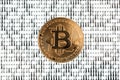 Bitcoin on binary code blurred background Royalty Free Stock Photo