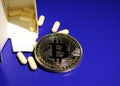 Bitcoin and bitter pills Royalty Free Stock Photo