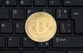 Bitcoin on a black computer keyboard Royalty Free Stock Photo