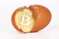 Bitcoin in broken egg.