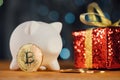 Bitcoin BTC cryptocurrency and Christmas gift box Royalty Free Stock Photo