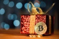 Bitcoin BTC cryptocurrency and Christmas gift box Royalty Free Stock Photo