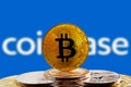 Bitcoin BTC on cryptocurrency with Coinbase logo background Royalty Free Stock Photo