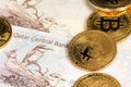 Bitcoin BTC cryptocurrency coins on Qatari Riyal. Virtual cryptocurrency concept.