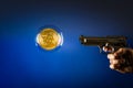 Bitcoin in a bubble with gun