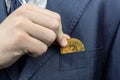 Bitcoin in the businessman`s pocket Royalty Free Stock Photo