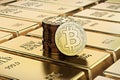 Bitcoin Cash coins laying on stacked gold bars gold ingots rendered with shallow depth of field. Royalty Free Stock Photo