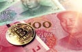 Bitcoin coin on Chinese Yuan bills. Bitcoin in China concept. 3D rendering