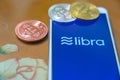 Bitcoin Coin with the Facebook`s Libra Crypto Coin logo