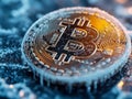 Bitcoin coin frozen, covered in ice on digital board, drop in value, declining, falling down, economics concept. macro shot.