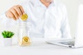 Bitcoin coin golden coin in the glass jar on wooden table ,Man h Royalty Free Stock Photo