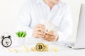 Bitcoin coin golden coin in the glass jar on wooden table ,Man t Royalty Free Stock Photo